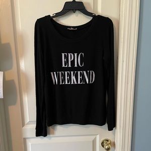 Black sweater says “Epic Weekend”